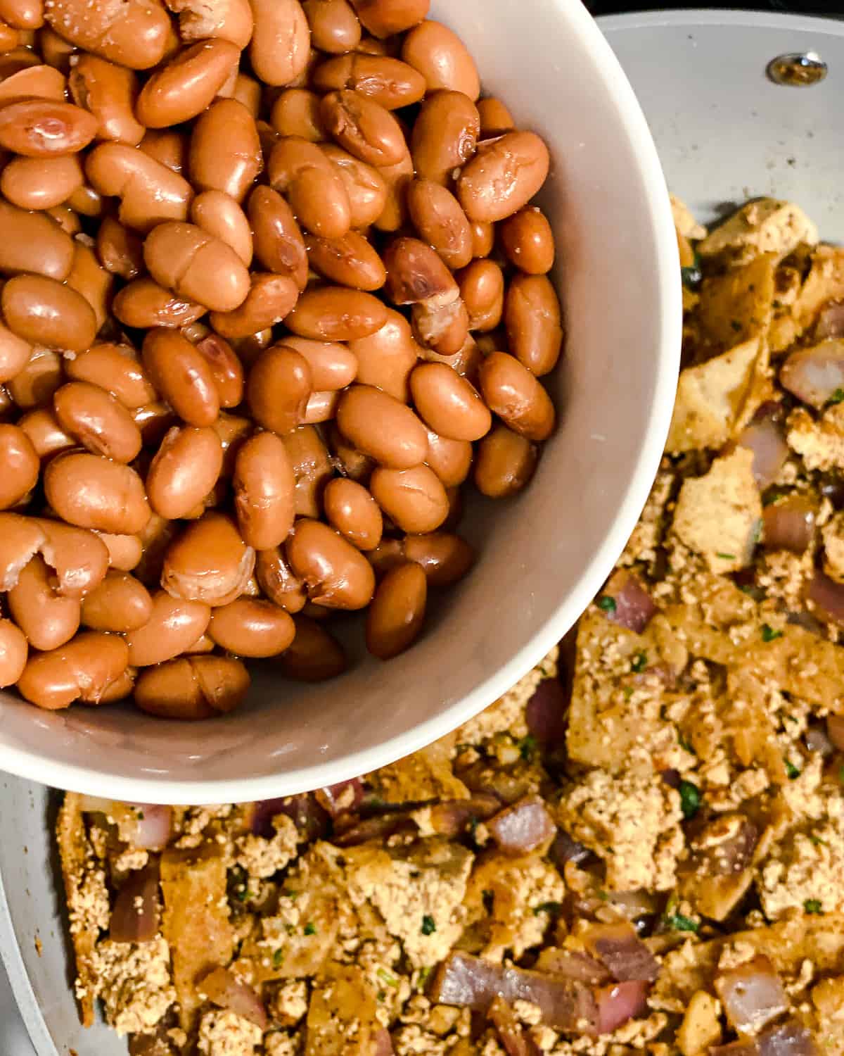 process shot of adding beans to pan