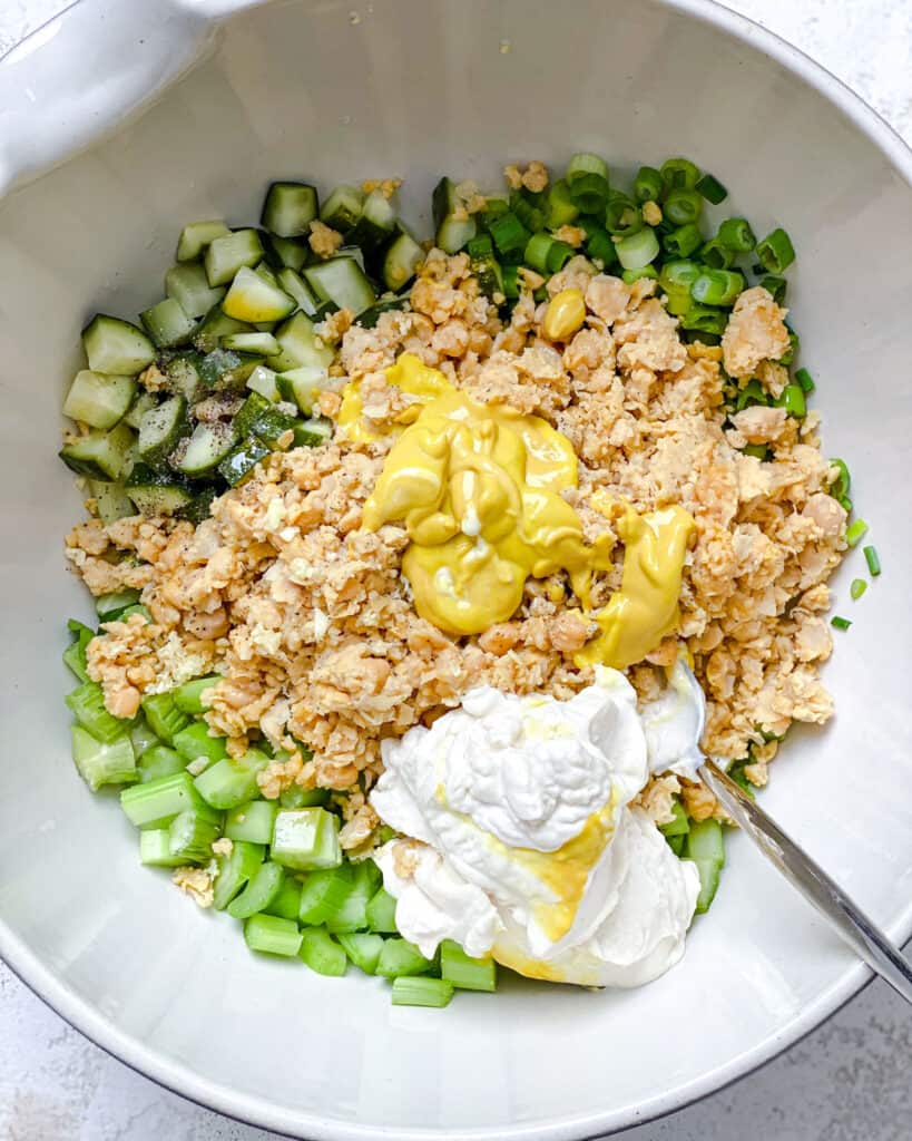 process shot of mixing ingredients together in a bowl