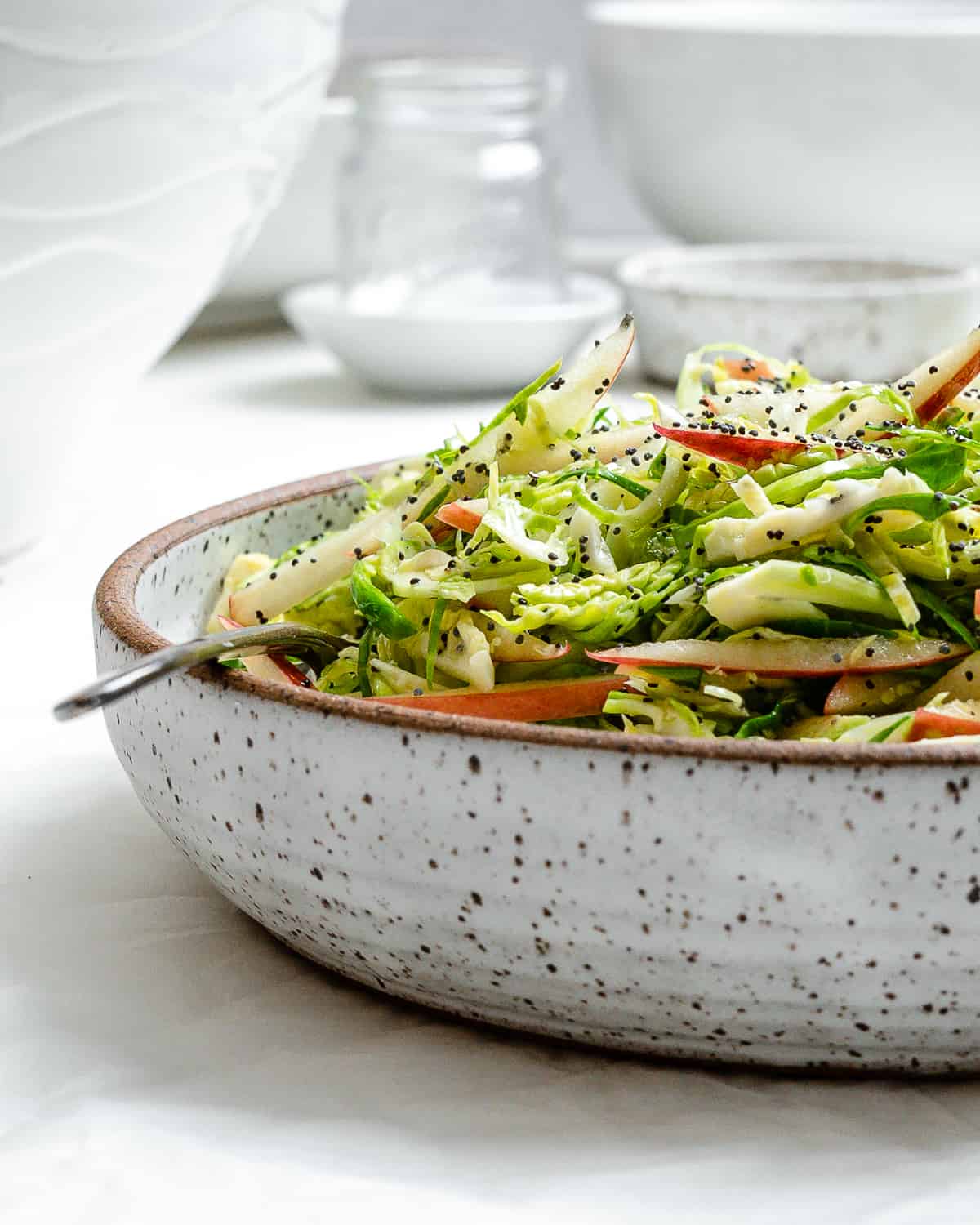 completed Shaved Brussel Sprout Slaw with Apples in a bowl