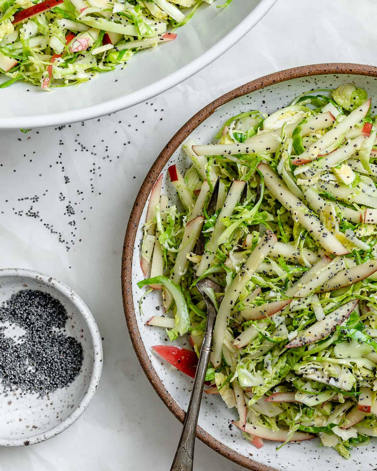 completed Shaved Brussel Sprout Slaw with Apples in a bowl 