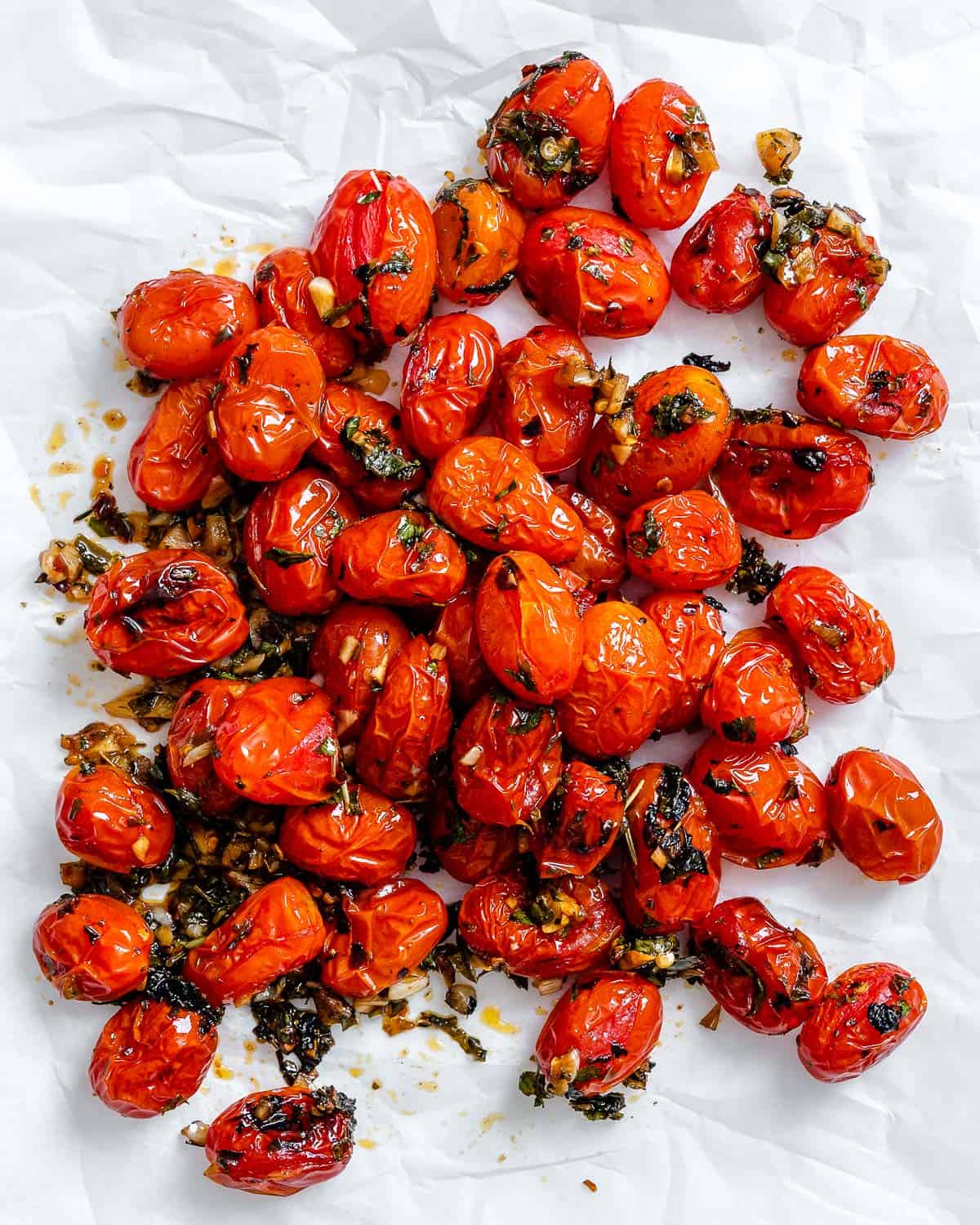 completed Easy Roasted Cherry Tomatoes against a white surface