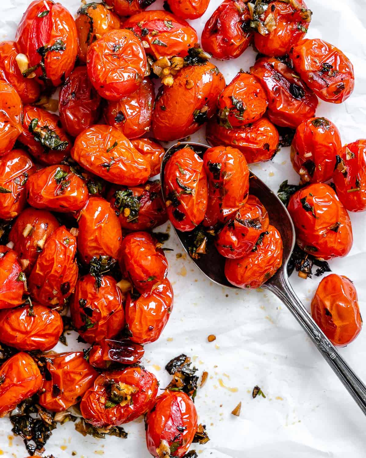 completed Easy Roasted Cherry Tomatoes against a white surface