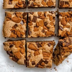 completed Vegan Biscoff Blondies against a white mixture