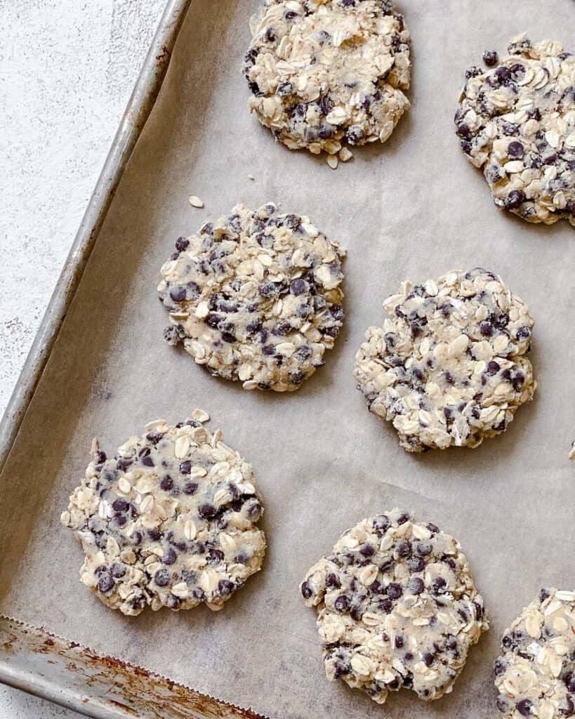 process shot of adding cookies to baking tray