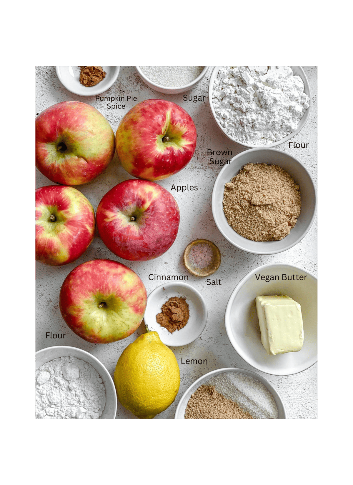 ingredients for The Best Vegan Apple Crumble measured out against a white surface