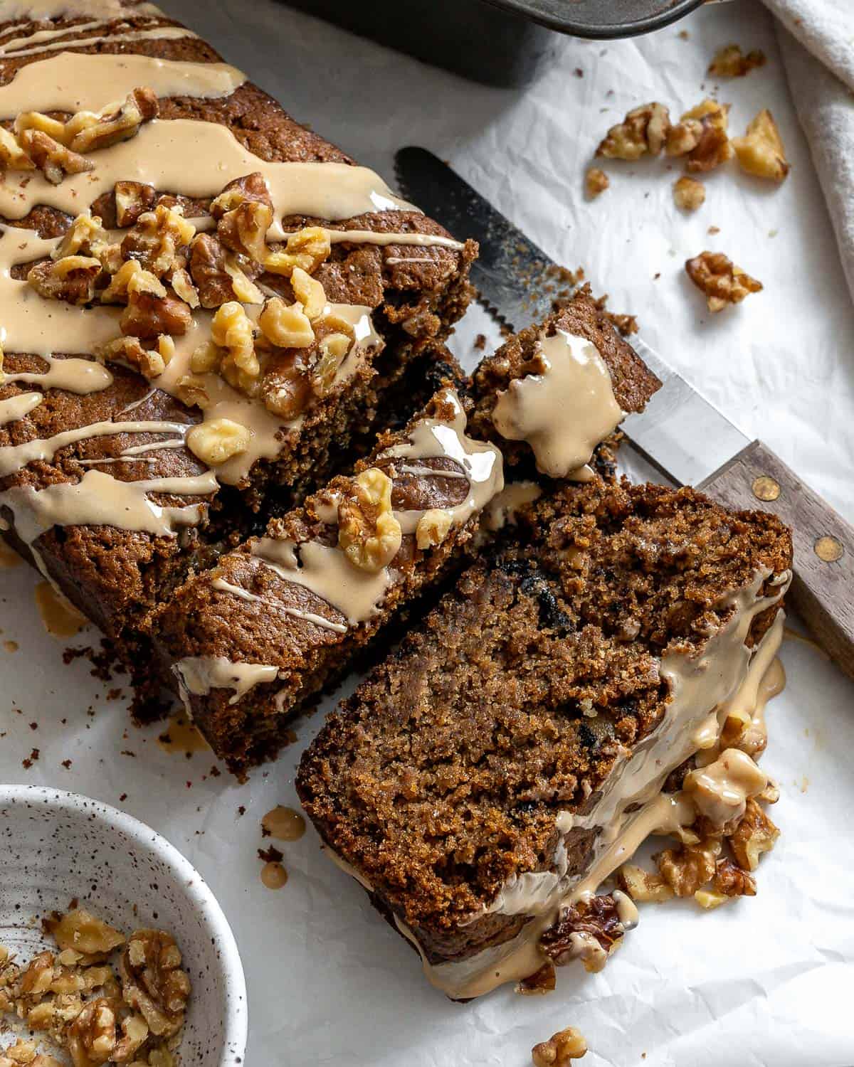 completed Coffee and Walnut Loaf Cake against a white surface