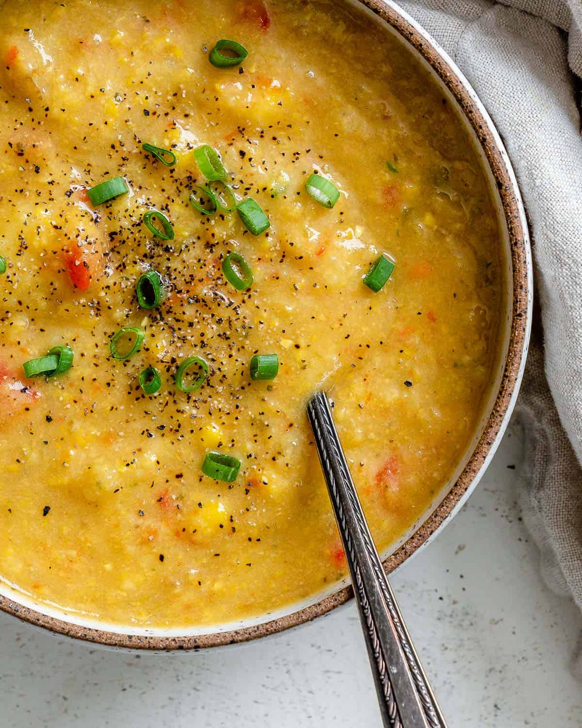 completed Corn Chowder in a bowl against a light surface