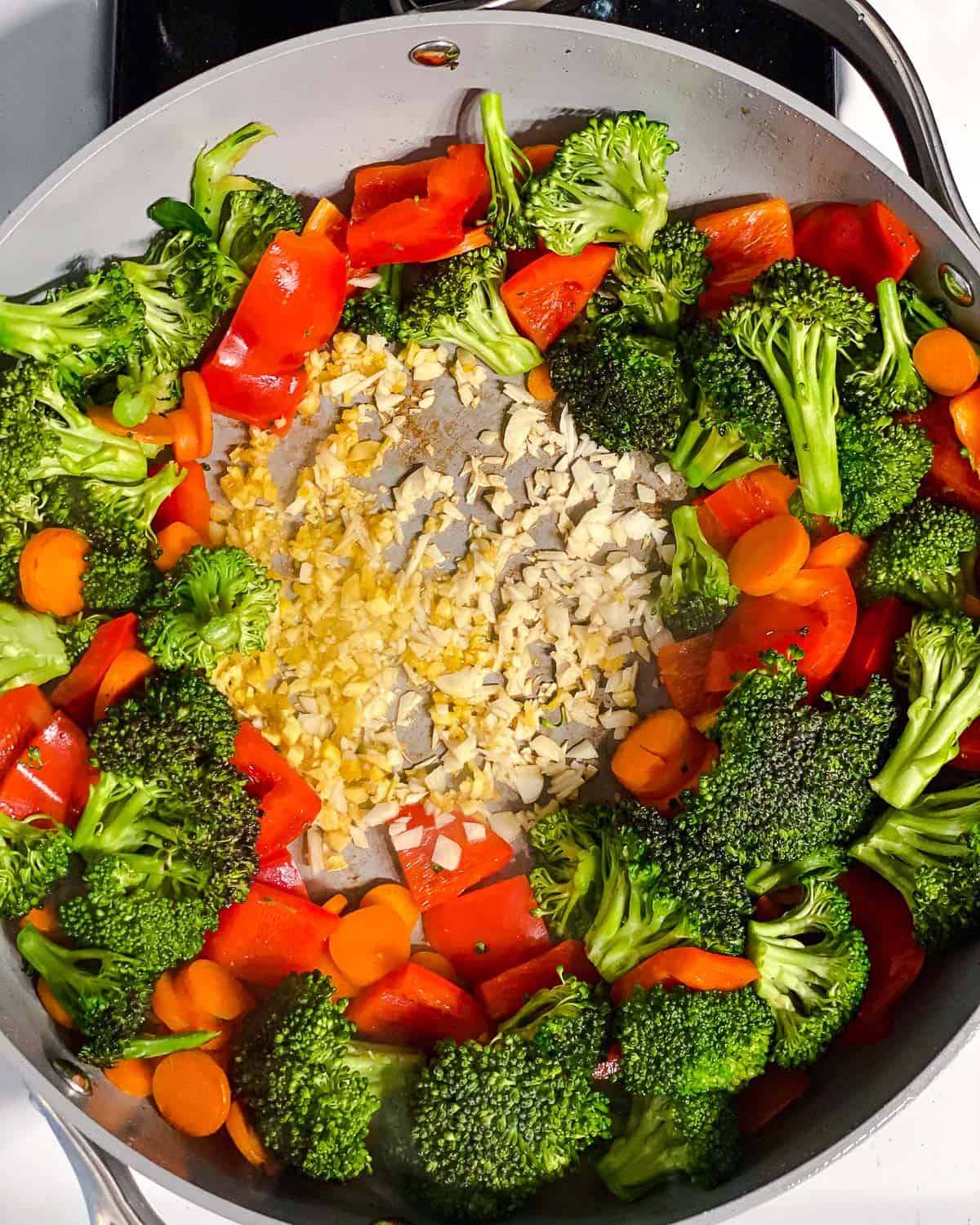 process shot of cooking veggies in pan