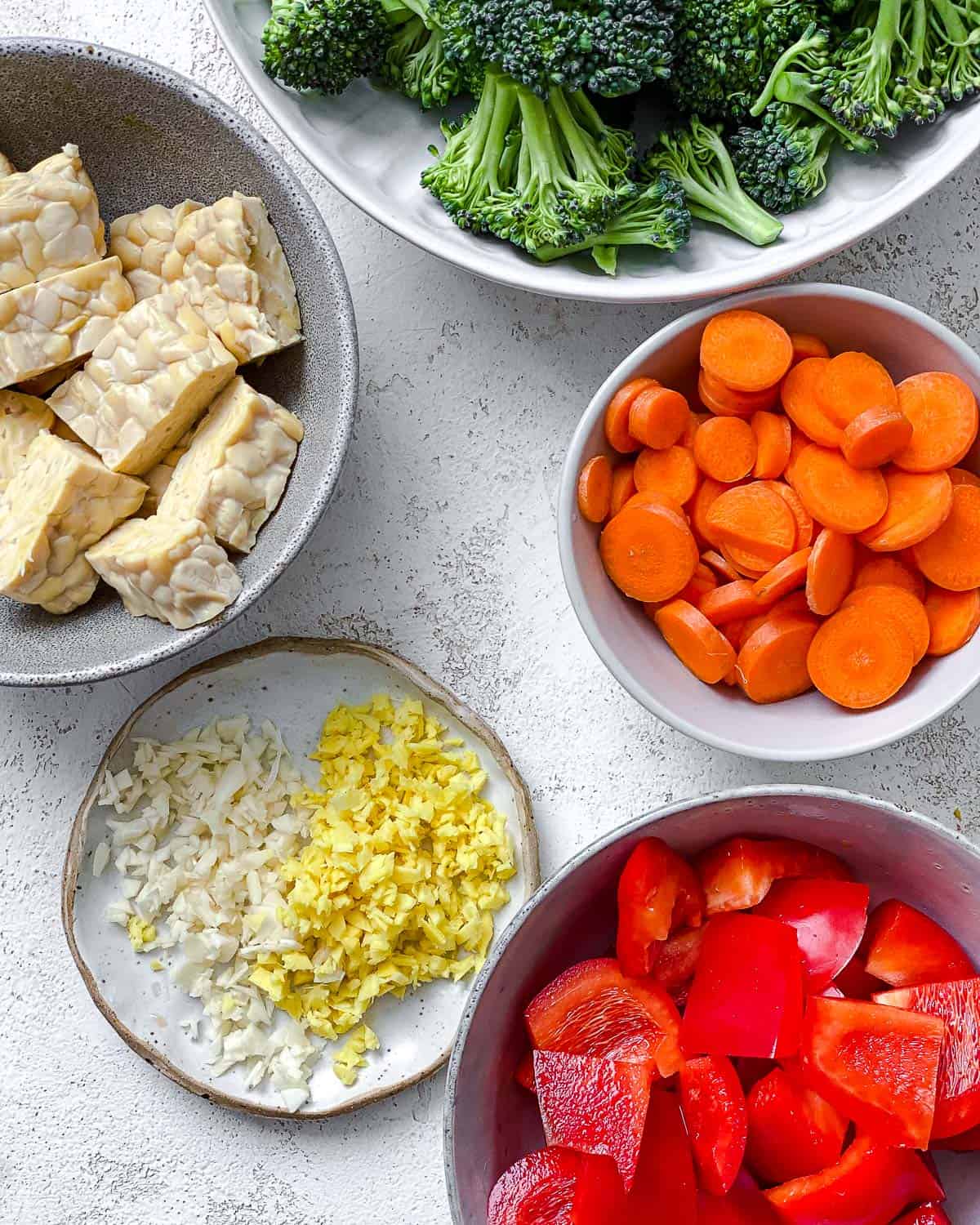 ingredients for Easy Tempeh Stir-Fry measured out against a white surface