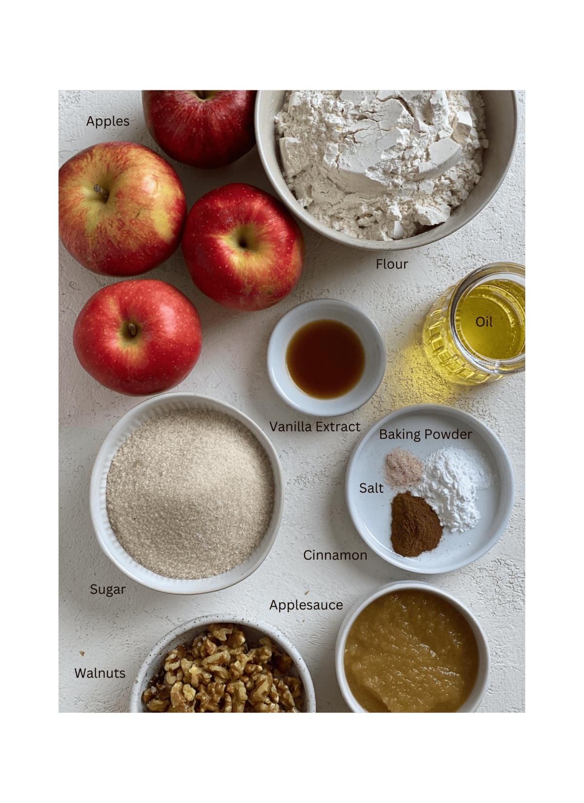 ingredients for Vegan Apple Muffins measured out against a white surface