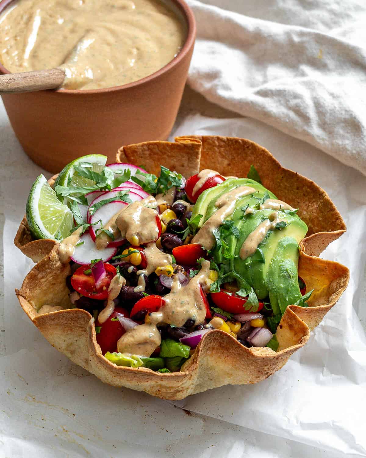 completed Vegan Chipotle Sauce [Taco Salad Dressing] alongside a taco salad