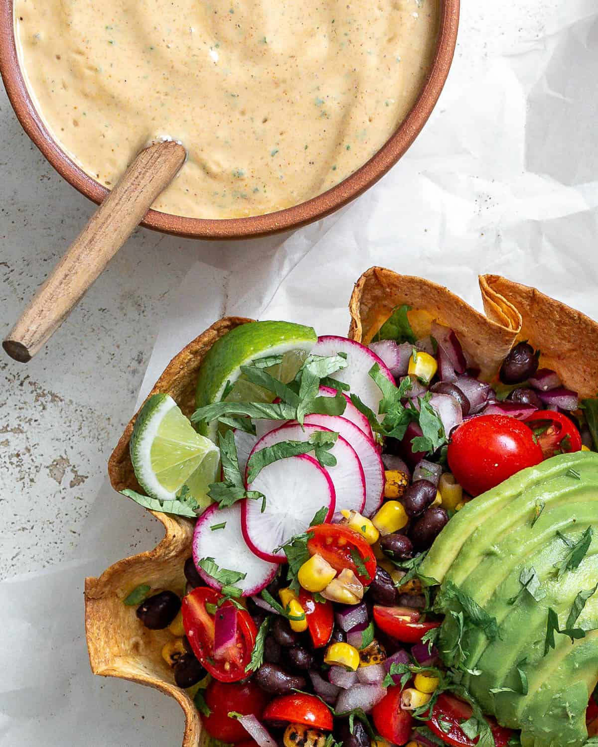 completed Vegan Chipotle Sauce [Taco Salad Dressing] alongside a taco salad