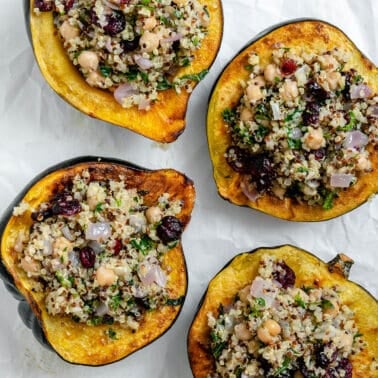 completed Vegan Stuffed Acorn Squash [With Quinoa] on a baking dish