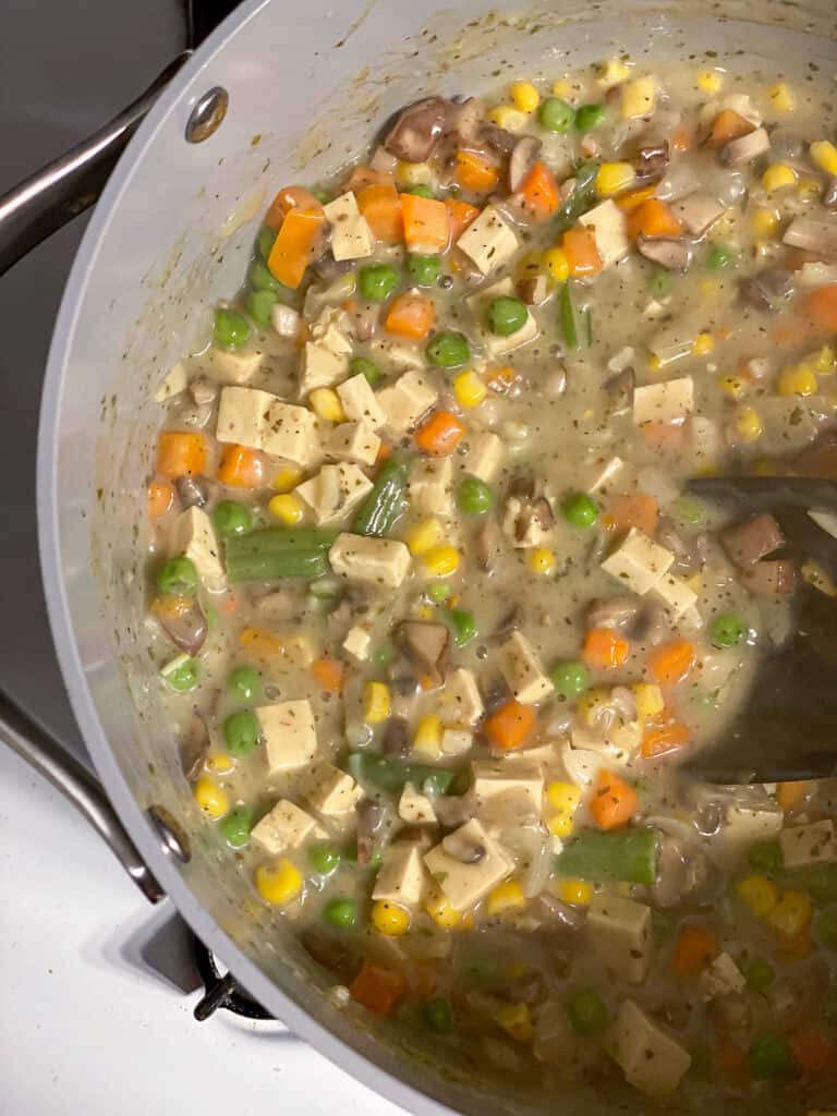 process shot of ingredients cooking in pan