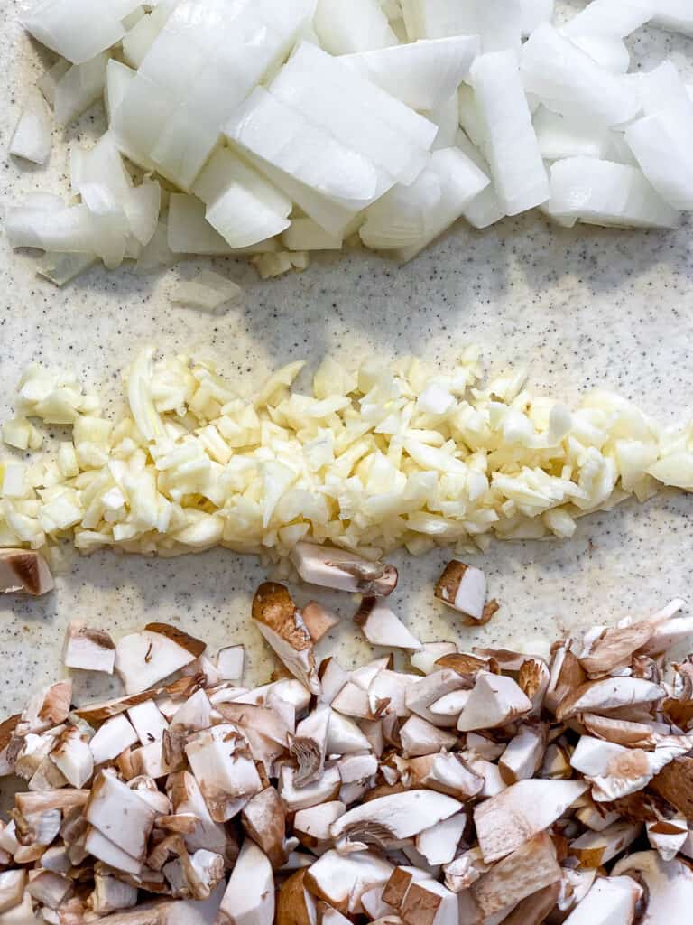 ingredients for Mixed Vegetable Vegan Pot Pie measured out against a white surfaceA