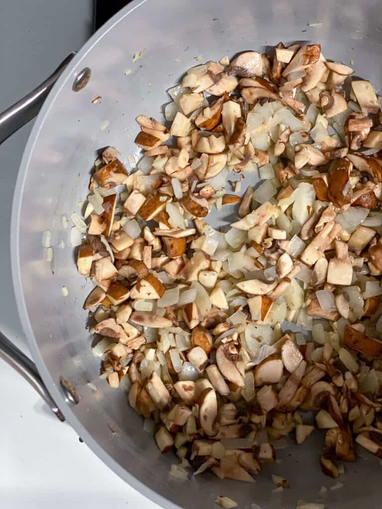 process shot showing ingredients cooking in pan