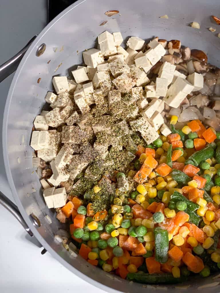 tofu added to pan of ingredients