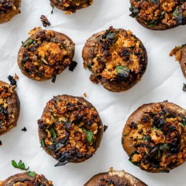 completed Easy Vegan Stuffed Mushrooms on a white surface