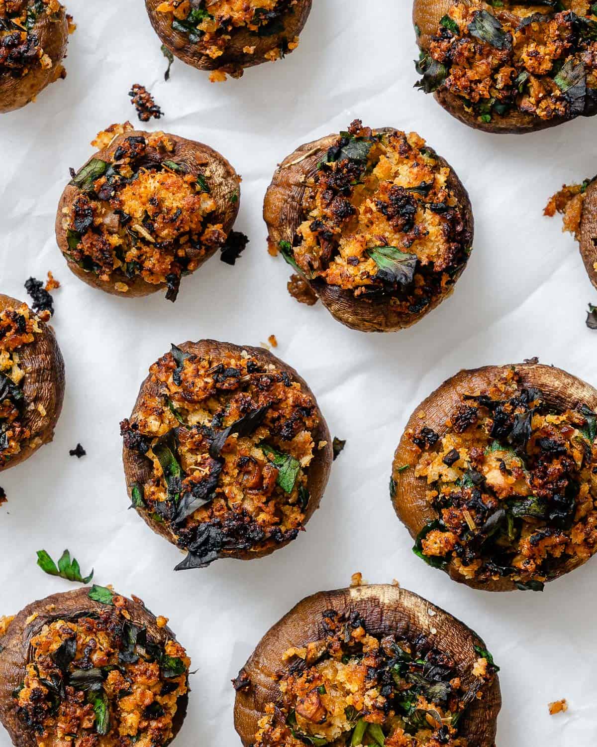 completed Easy Vegan Stuffed Mushrooms on a white surface