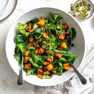 completed Easy Roasted Pumpkin Salad plated on a white surface