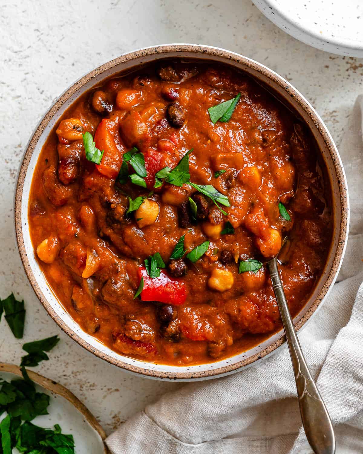 completed Vegan Pumpkin Chili [Crockpot + Stove] on a white surface