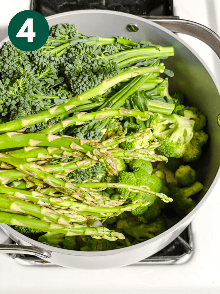 process shot of adding asparagus to pan