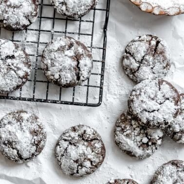 completed Vegan Chocolate Crinkle Cookies on a white surface