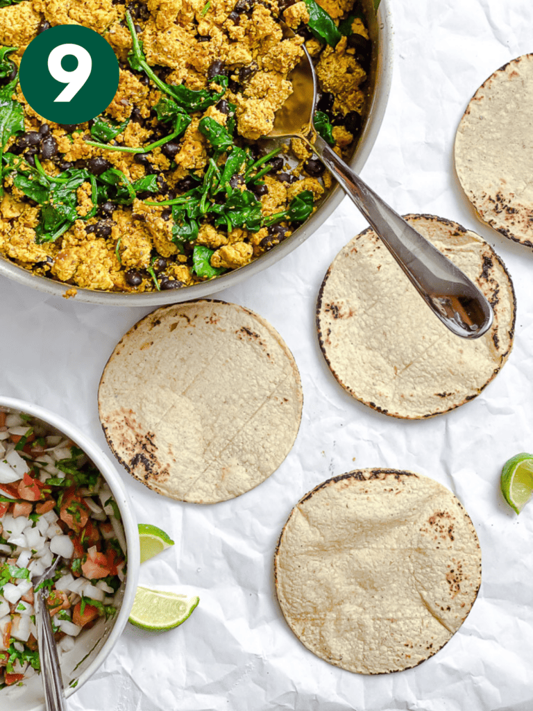 process shot showing pan of tofu mixture alongside tortillas