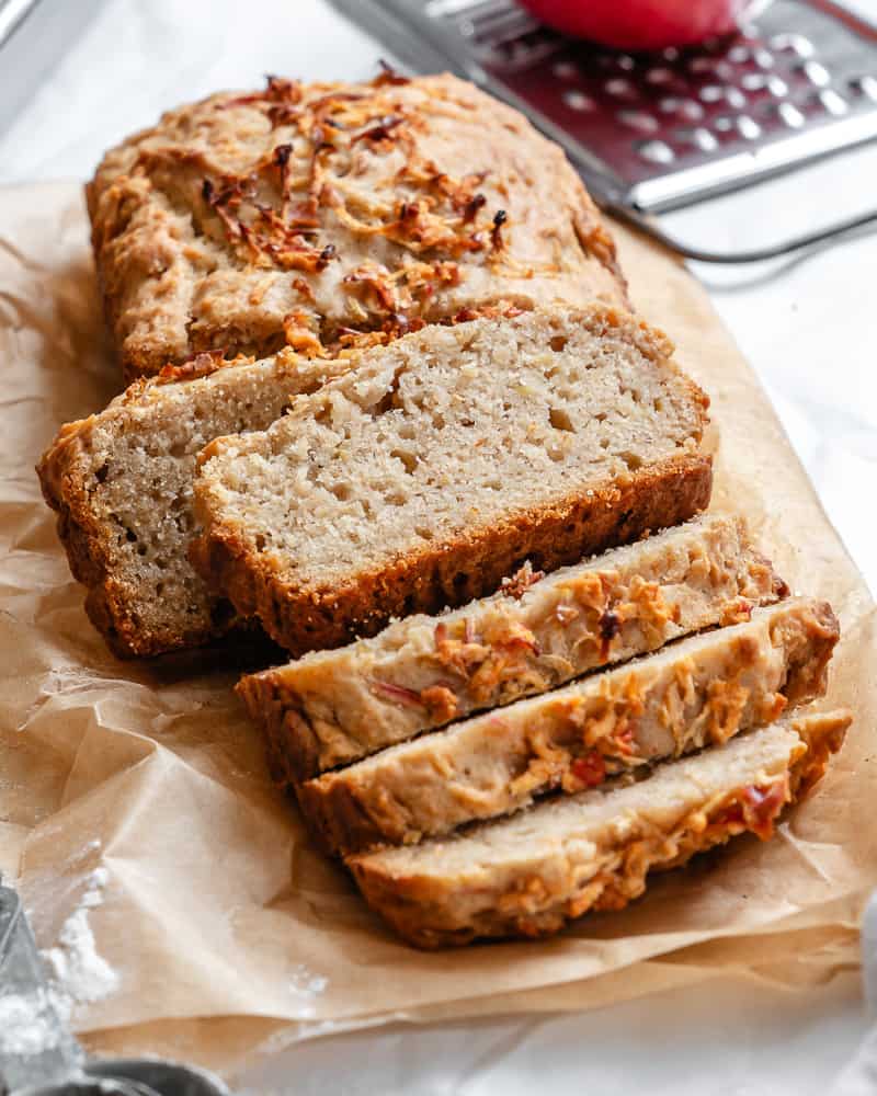 sliced apple cinnamon bread on a piece of parchment paper.