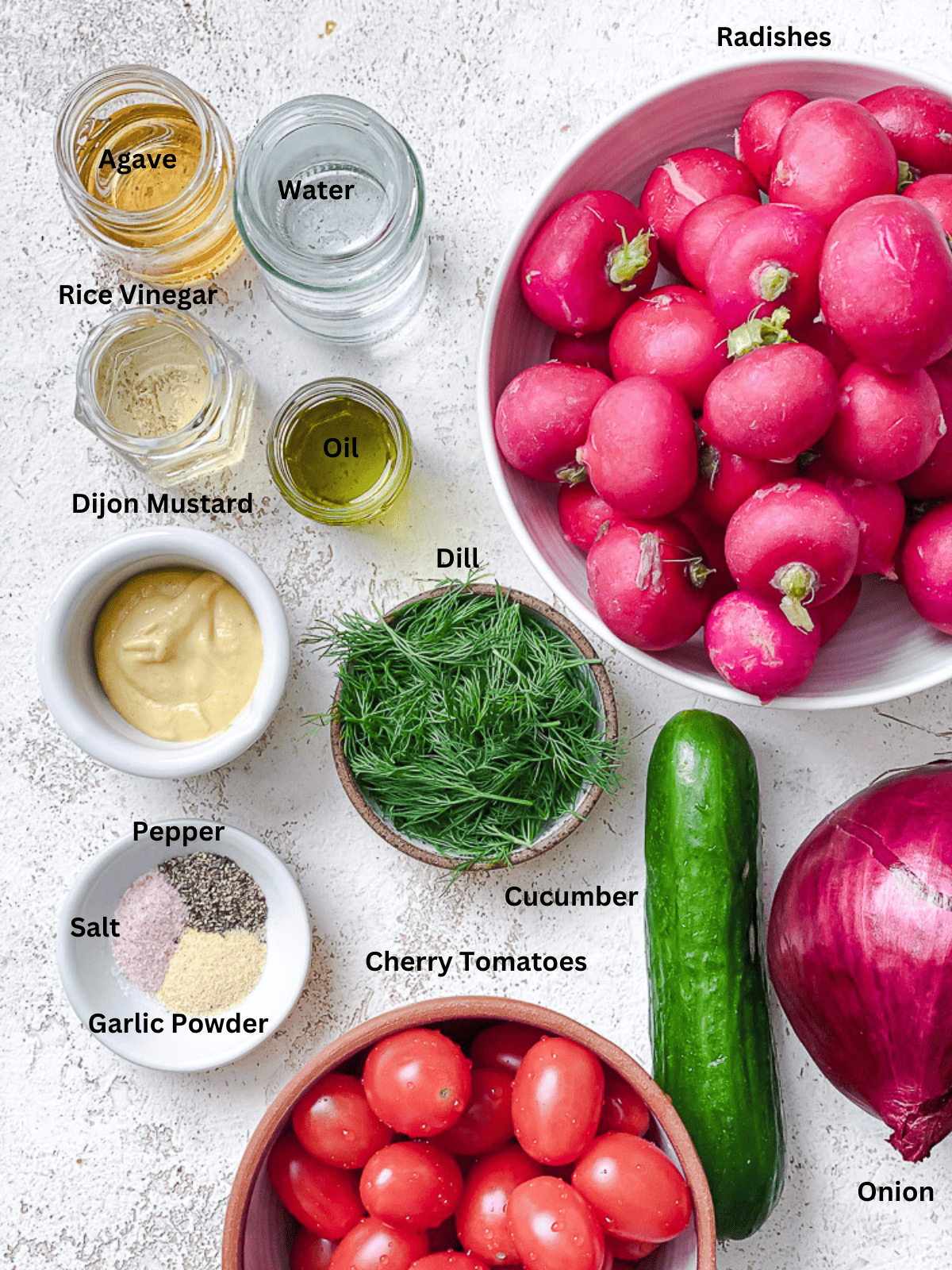 ingredients for Cucumber Radish Salad on a white surface