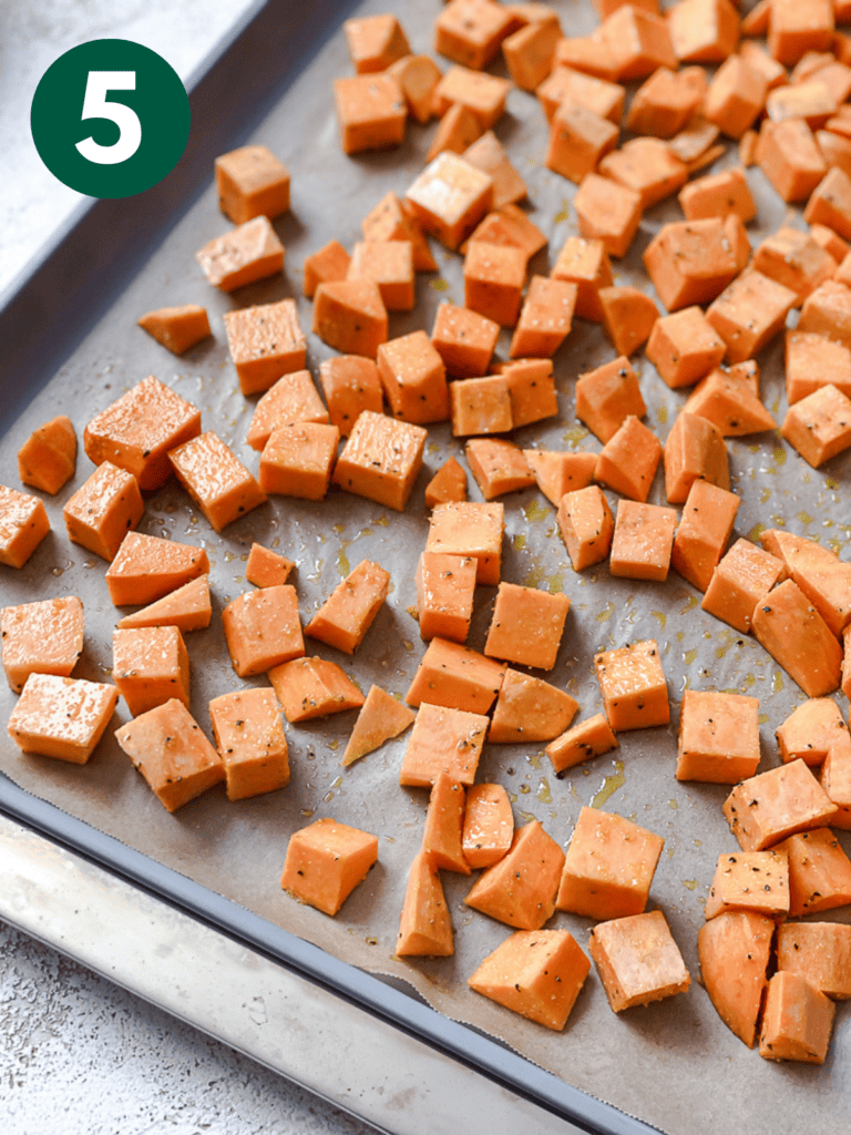 process shot showing sweet potatoes on baking tray