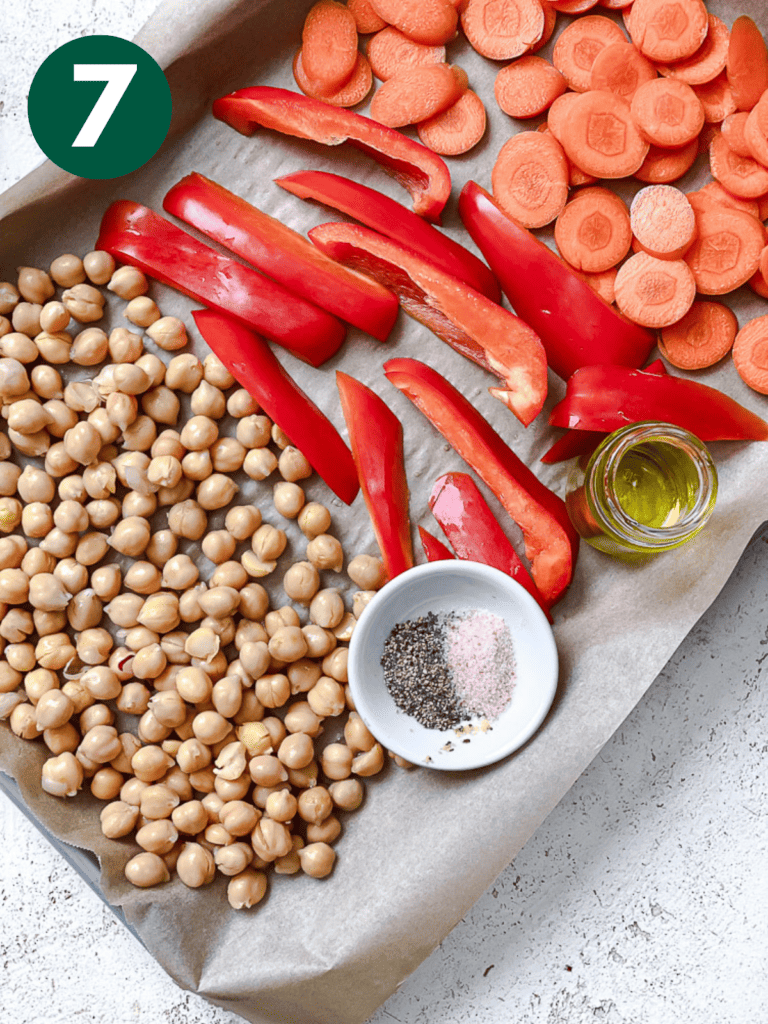 process shot showing veggies on baking dish