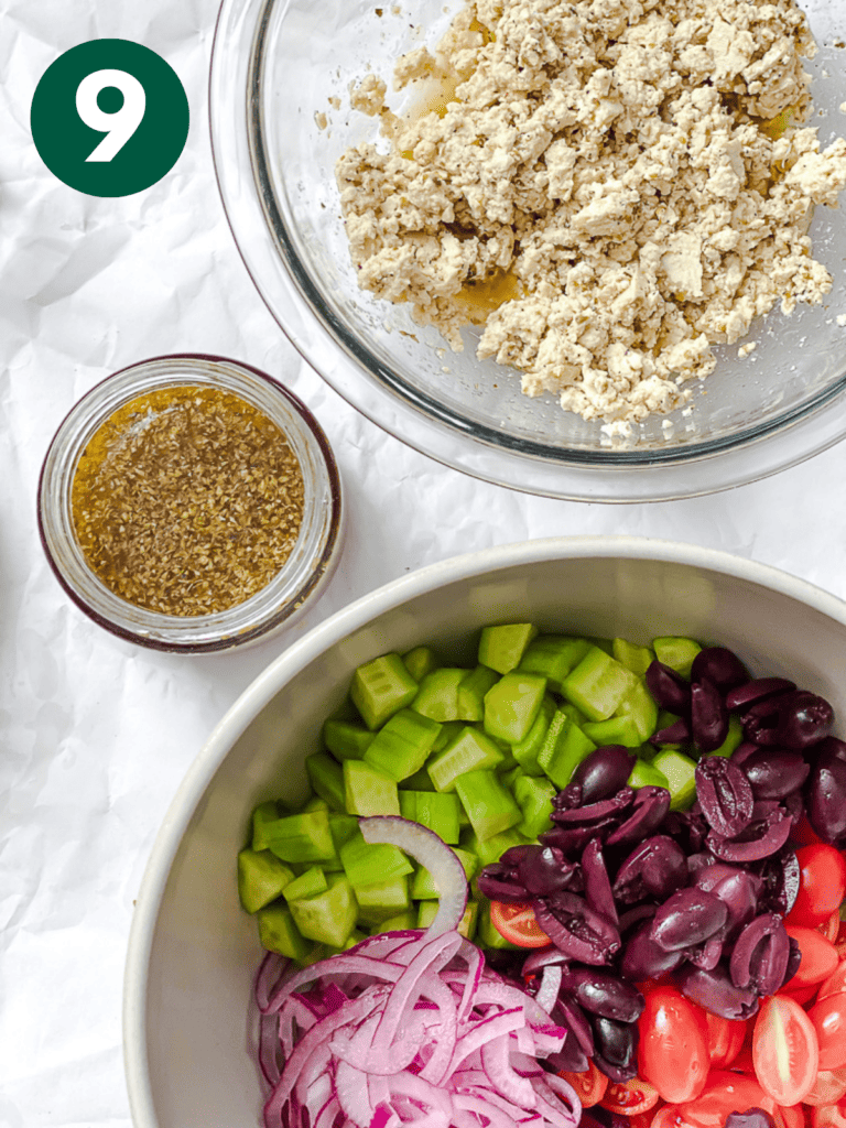 process shot showing dressing, tofu mixture, and veggies in bowl