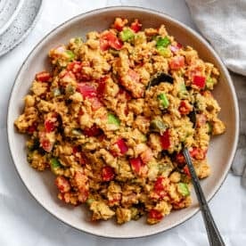 vegan garbanzo bean salad in a large white bowl.