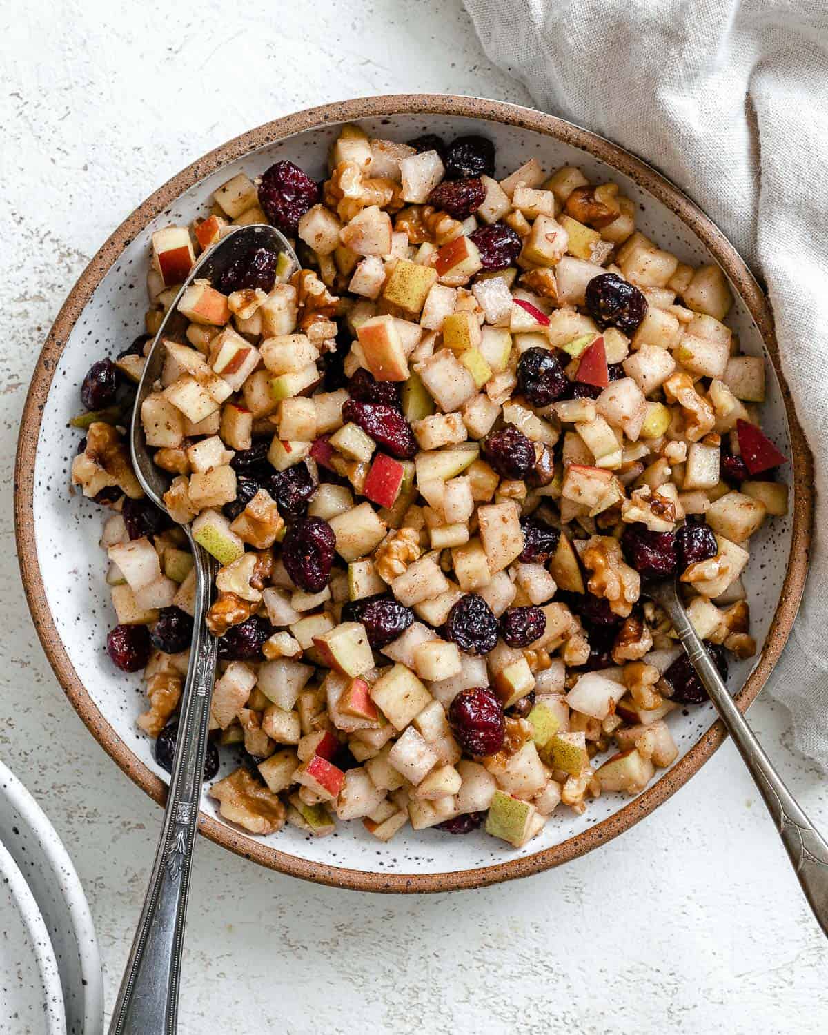 chunky charoset in a large white bowl.