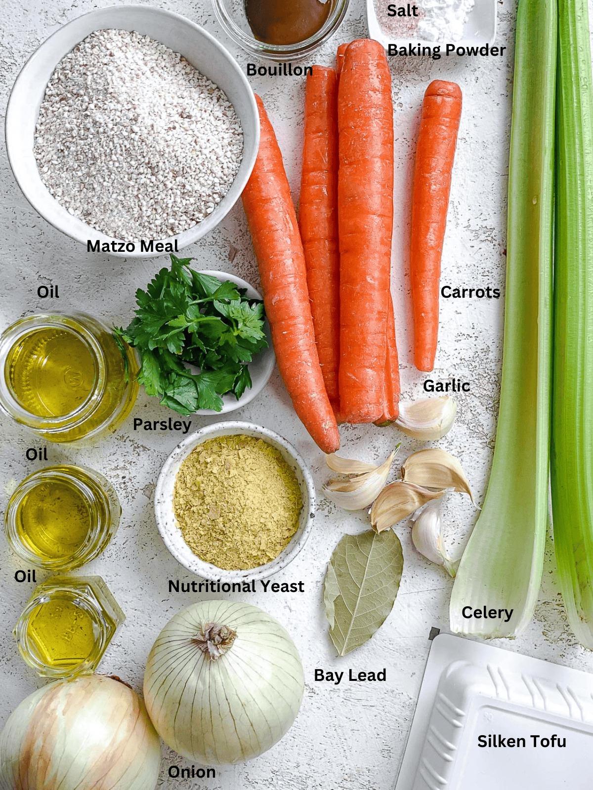 ingredients for Vegan Matzo Ball Soup measured out on a white surface