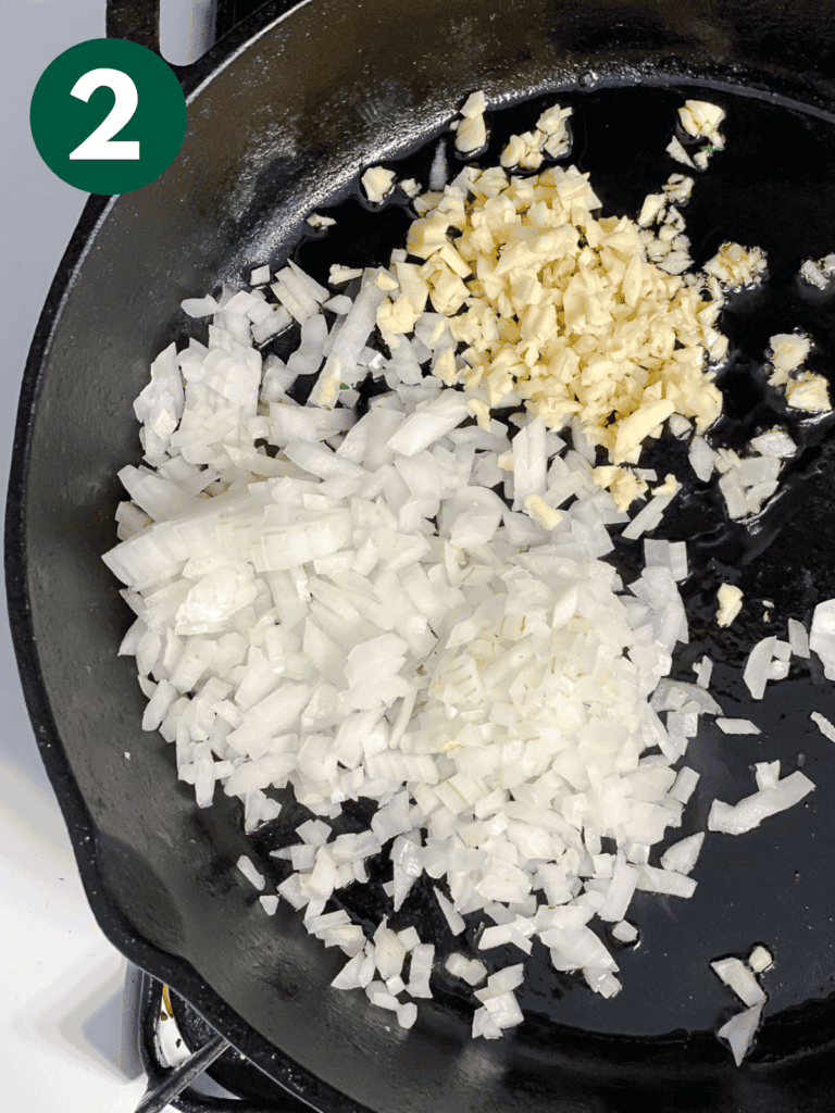 process shot showing onions and garlic in pan