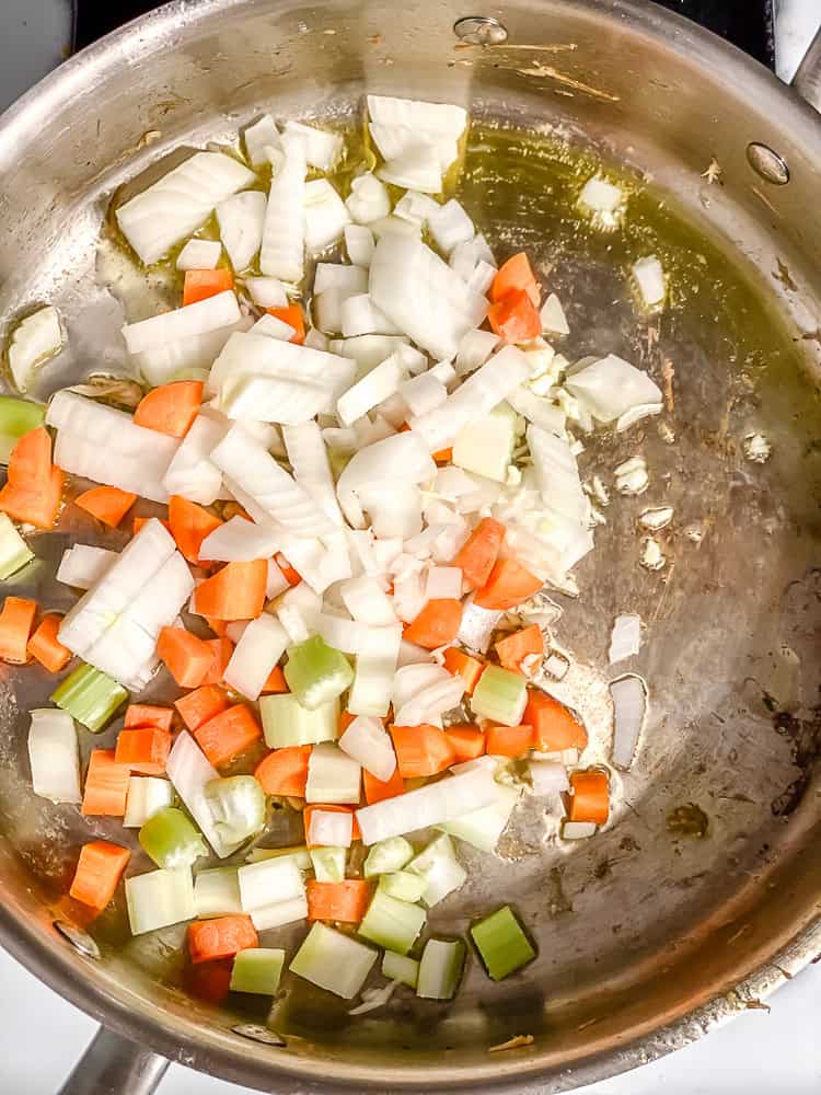 process shot of veggies cooking in pot