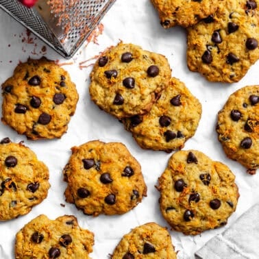 baked sweet potato cookies next to a box grater.