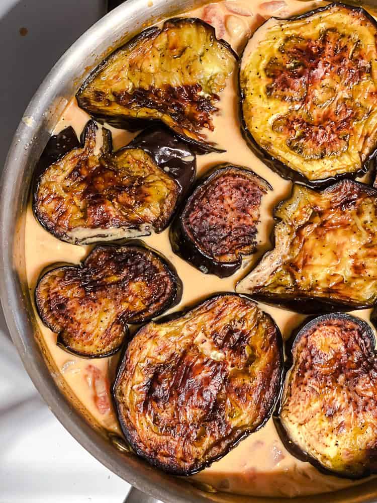 process shot showing eggplant cooking in pan