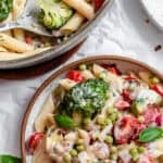 vegan pasta primavera in a white bowl.