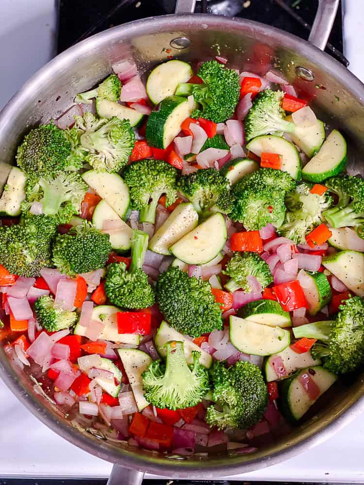 vegetables cooking in a large pot.