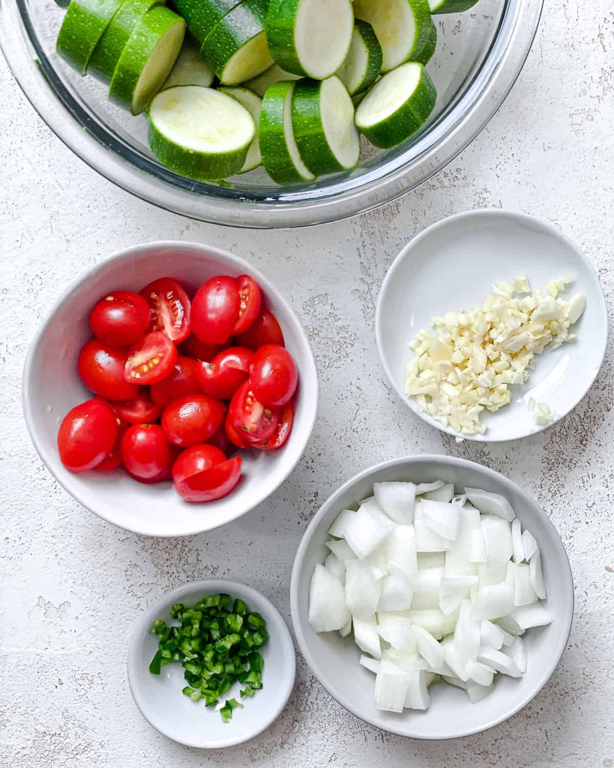 process shot showing diced veggies on separate plates