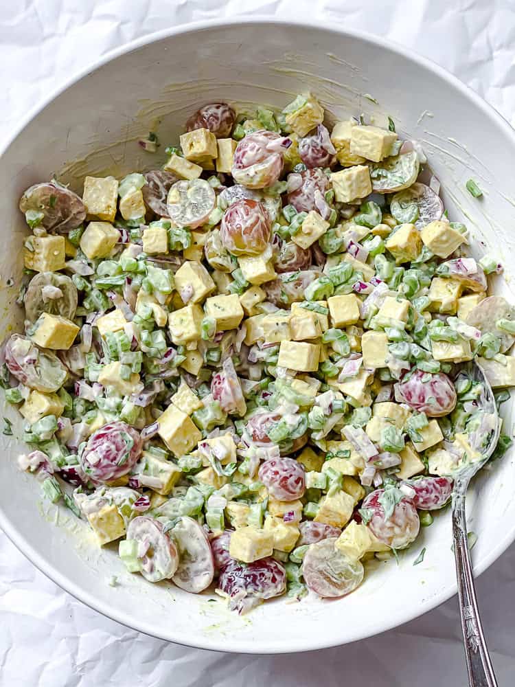 process shot showing mixing vegan chicken salad ingredients together