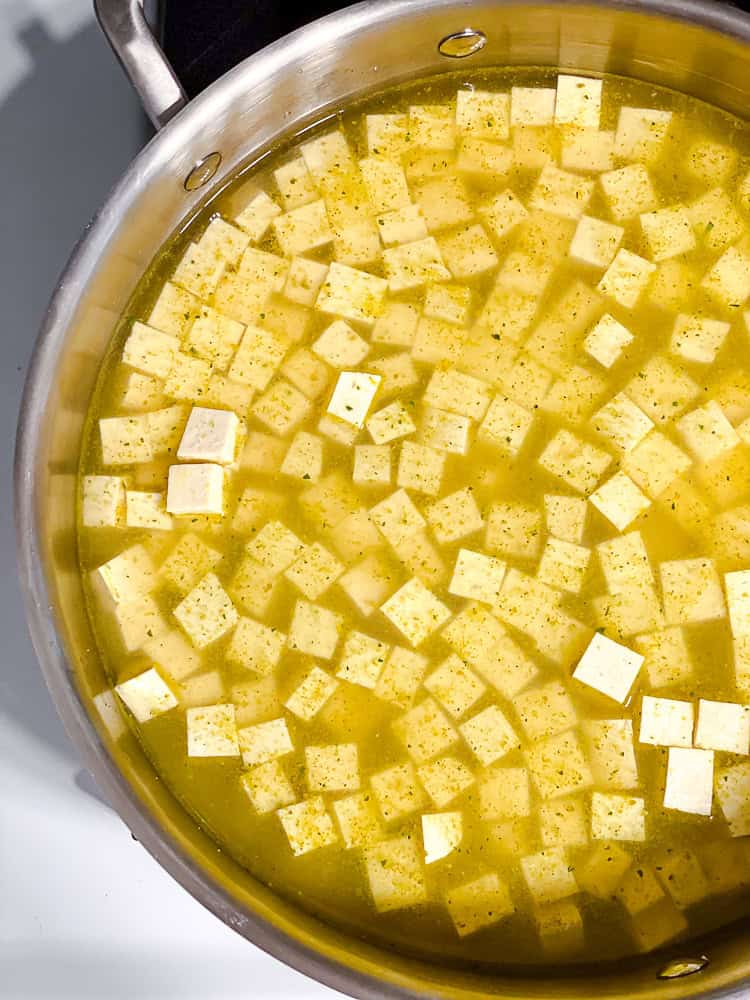 process shot showing tofu cooking in pan