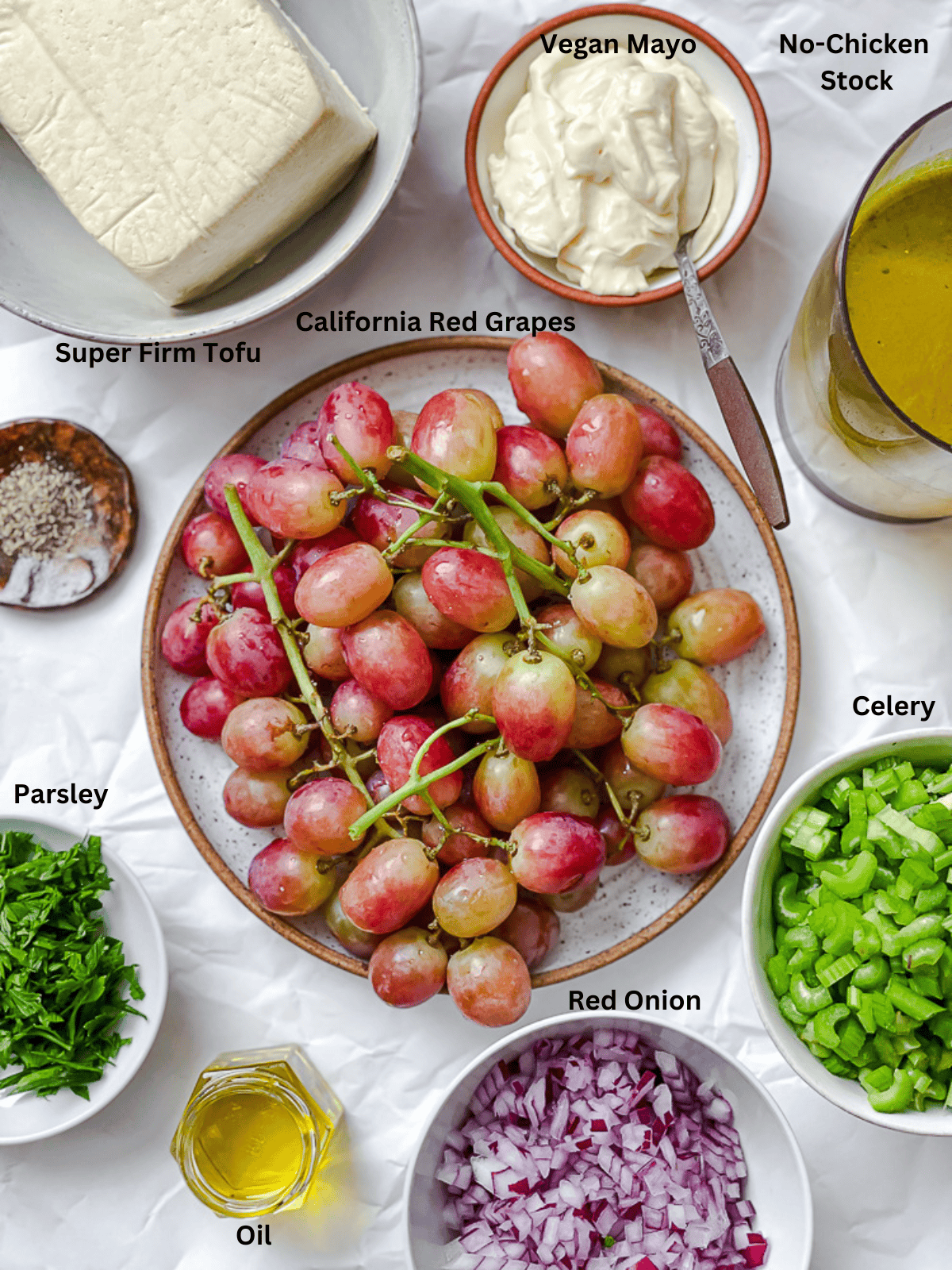 ingredients for Vegan Chicken and California Grape Salad measured out on a white surface