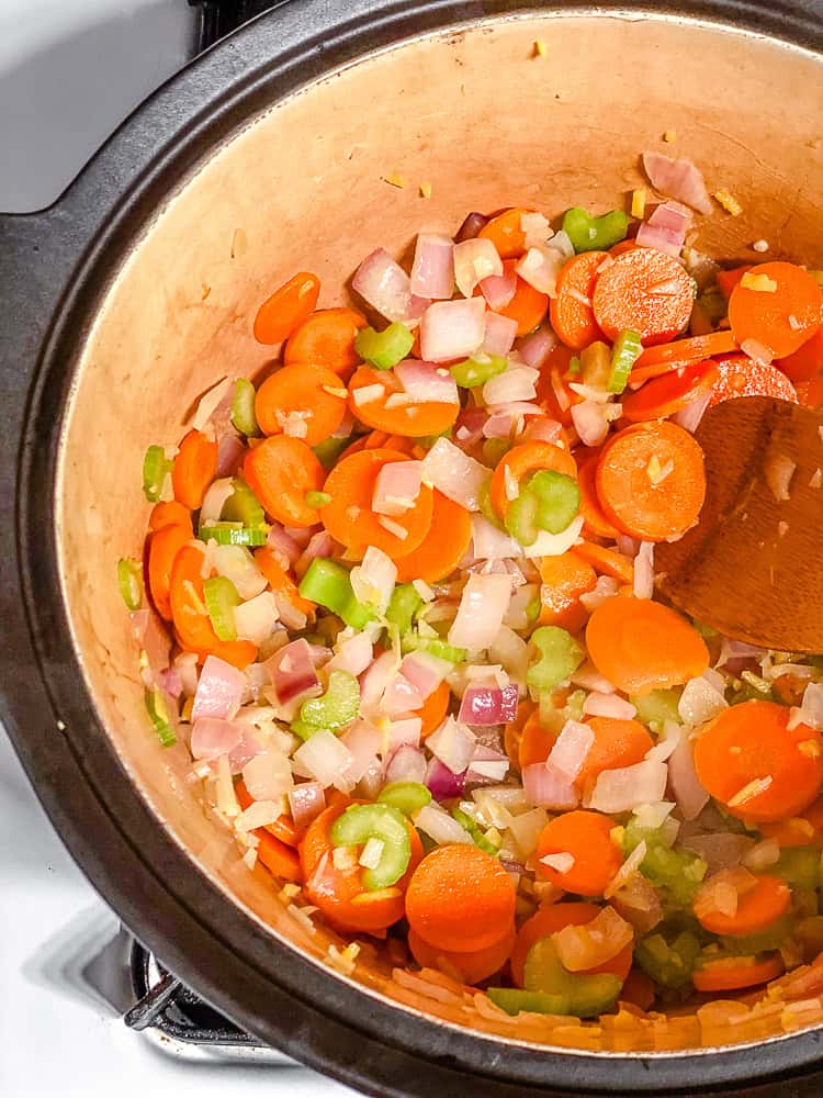 process shot showing veggies cooking in pot