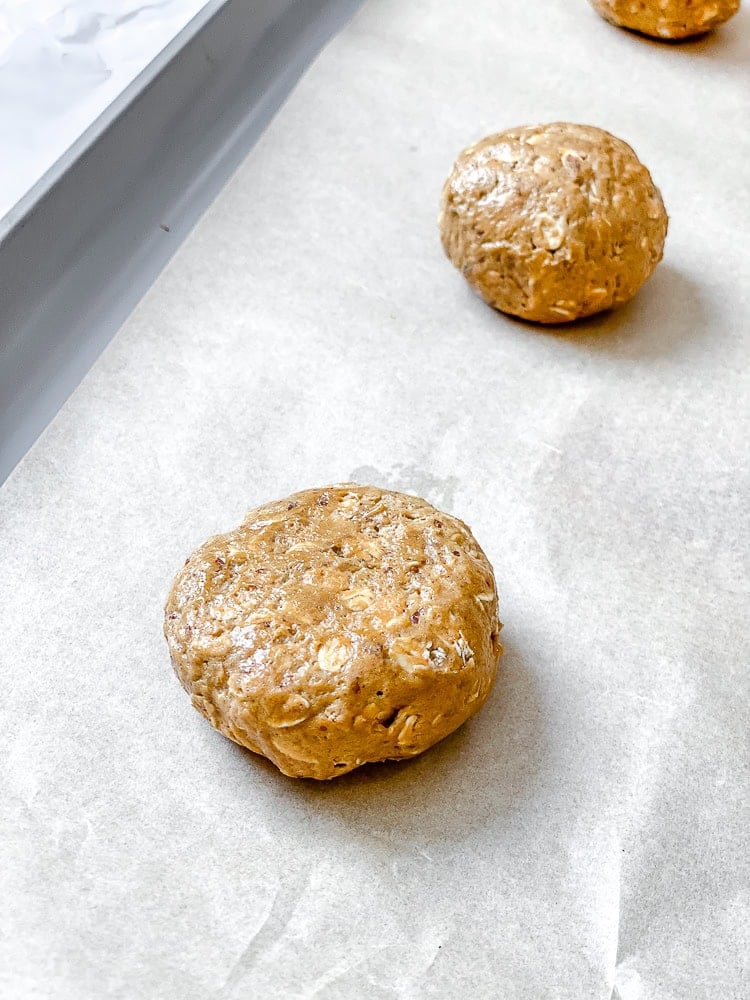 process shot showing cookie dough on baking sheet