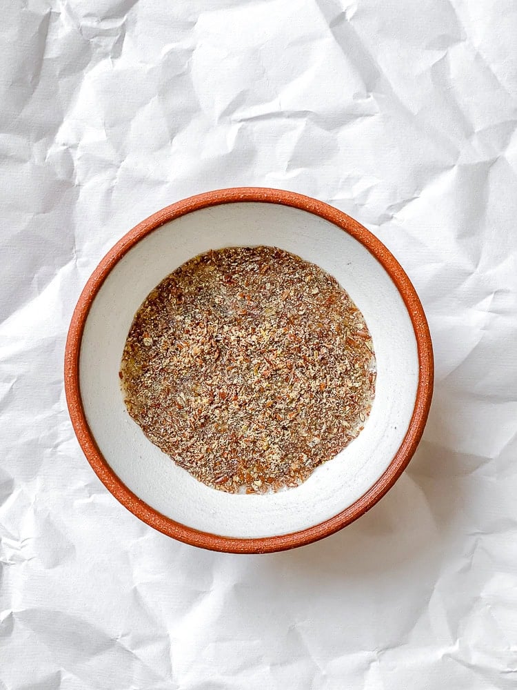 process shot showing flax meal and water in bowl