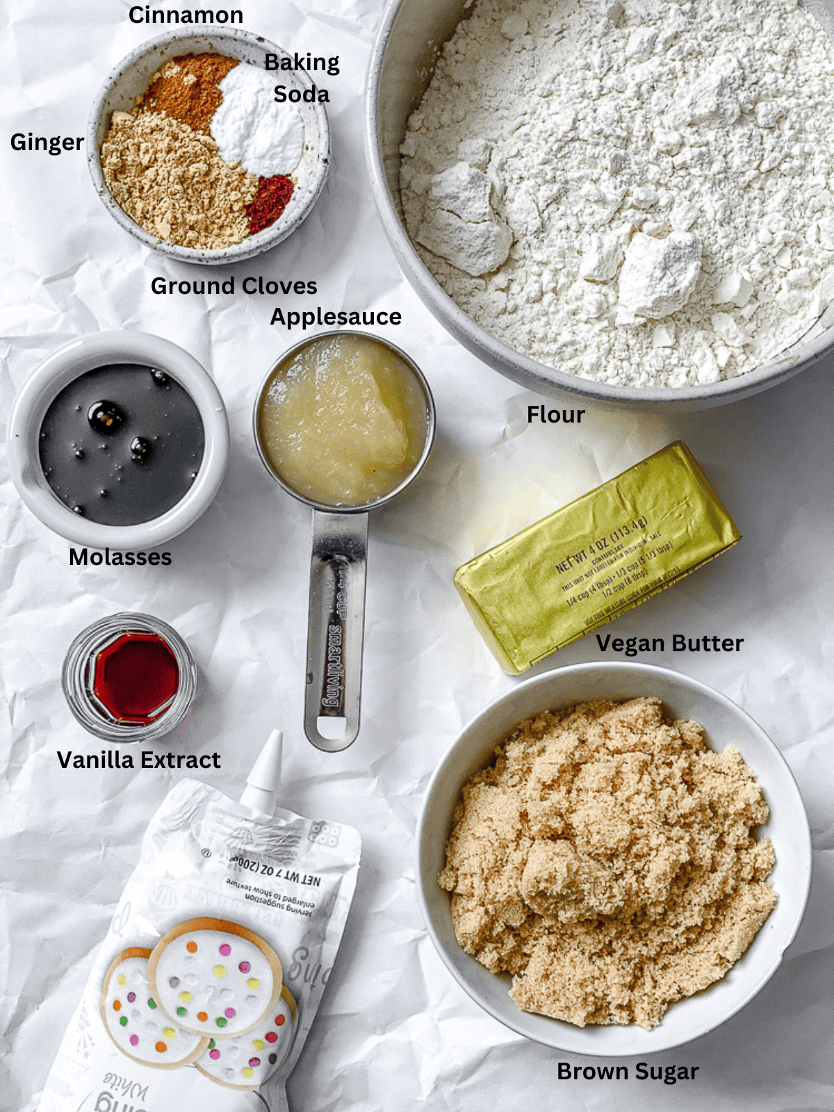 ingredients for Vegan Gingerbread Cookies measured out on a white surface